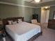 Large main bedroom with a king-size bed, ceiling fan, and walk-in closet at 779 Nectar Rd, Venice, FL 34293