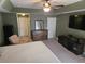 Main bedroom featuring a king-size bed, ceiling fan, and ample space for furniture at 779 Nectar Rd, Venice, FL 34293