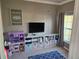 ' playroom with toys, storage units, and a TV at 779 Nectar Rd, Venice, FL 34293