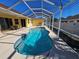 Inviting pool area enclosed by a screen enclosure at 779 Nectar Rd, Venice, FL 34293