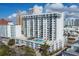 Aerial view of the condo building, pool, and surrounding area at 101 S Gulfstream Ave # 15E, Sarasota, FL 34236