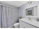 Clean bathroom with white vanity and shower/tub combo at 101 S Gulfstream Ave # 15E, Sarasota, FL 34236