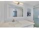 Clean bathroom, featuring a white vanity and large mirror at 101 S Gulfstream Ave # 15E, Sarasota, FL 34236