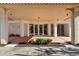 Modern condominium building entrance with covered walkway and landscaping at 101 S Gulfstream Ave # 15E, Sarasota, FL 34236