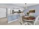 Charming dining area with a round table and four chairs at 101 S Gulfstream Ave # 15E, Sarasota, FL 34236
