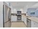 Modern kitchen featuring stainless steel appliances and white cabinets at 101 S Gulfstream Ave # 15E, Sarasota, FL 34236