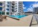 Inviting community pool with surrounding deck and seating at 101 S Gulfstream Ave # 15E, Sarasota, FL 34236