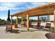 Relaxing pool deck with pergola and lounge chairs at 101 S Gulfstream Ave # 15E, Sarasota, FL 34236