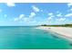 Expansive beach view with turquoise water at 108 Corte Del Rosa, Venice, FL 34285