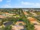 Aerial view of single-Gathering home with solar panels and surrounding houses at 108 Corte Del Rosa, Venice, FL 34285