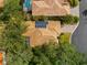 Top-down view of single-Gathering house with solar panels at 108 Corte Del Rosa, Venice, FL 34285