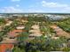 Property's aerial view shows its location in a residential neighborhood at 108 Corte Del Rosa, Venice, FL 34285