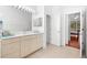 Bathroom with double vanity, and access to other rooms at 108 Corte Del Rosa, Venice, FL 34285