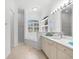 Spacious bathroom with double vanity, soaking tub, and separate shower at 108 Corte Del Rosa, Venice, FL 34285