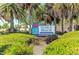 Venice Beach entrance sign with lush landscaping at 108 Corte Del Rosa, Venice, FL 34285