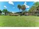 Modern beach pavilion with palm trees and lawn at 108 Corte Del Rosa, Venice, FL 34285