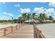 Wooden boardwalk leading to beachfront restaurant at 108 Corte Del Rosa, Venice, FL 34285