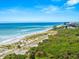 Aerial view of beach, vegetation and ocean at 108 Corte Del Rosa, Venice, FL 34285