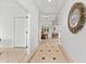 Bright entryway with tile flooring and ornate mirror at 108 Corte Del Rosa, Venice, FL 34285
