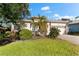Single-story home with a two-car garage and lush landscaping at 108 Corte Del Rosa, Venice, FL 34285