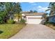 Beautiful home exterior with a brick driveway at 108 Corte Del Rosa, Venice, FL 34285