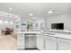 Spacious kitchen island with sink and dishwasher at 108 Corte Del Rosa, Venice, FL 34285