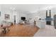 Open floor plan with kitchen island and spacious living area at 108 Corte Del Rosa, Venice, FL 34285