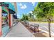 Quaint streetscape with benches and lush landscaping at 108 Corte Del Rosa, Venice, FL 34285