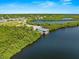 Park near canal with lush green vegetation at 108 Corte Del Rosa, Venice, FL 34285