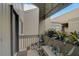 Small balcony with potted plants and a bench at 109 Woodland Pl, Osprey, FL 34229