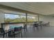 Spacious balcony with seating and scenic views of the pool and surrounding area at 109 Woodland Pl, Osprey, FL 34229