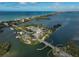 Aerial view of an island with docking areas, surrounded by calm water at 109 Woodland Pl, Osprey, FL 34229