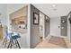 Modern kitchen with white countertops, stainless steel appliances, and breakfast bar at 109 Woodland Pl, Osprey, FL 34229
