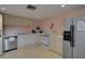 Community kitchen with stainless steel appliances, ample counter space, and plenty of storage at 109 Woodland Pl, Osprey, FL 34229