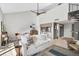 Spacious living room with high ceilings, spiral staircase, and open-concept design at 109 Woodland Pl, Osprey, FL 34229