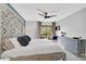 Inviting main bedroom featuring a unique headboard, ceiling fan, and balcony access at 109 Woodland Pl, Osprey, FL 34229