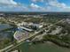 Aerial shot of a marina surrounded by buildings, greenery, and waterfront access at 109 Woodland Pl, Osprey, FL 34229