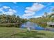 Scenic waterfront view with lush greenery and a 