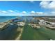 Aerial view of the waterways, vegetation, and beachfront properties along the coast at 109 Woodland Pl, Osprey, FL 34229