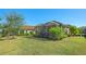 Private backyard with screened lanai and lush landscaping at 12667 Sorrento Way, Bradenton, FL 34211