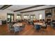 Clubhouse dining room with fireplace and outdoor view at 12667 Sorrento Way, Bradenton, FL 34211