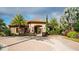 Clubhouse with outdoor patio, landscaping, and paved walkways at 12667 Sorrento Way, Bradenton, FL 34211