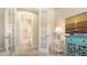 Comfy living room with French doors opening to a bathroom at 12667 Sorrento Way, Bradenton, FL 34211