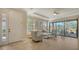 Inviting living room with tiled flooring, comfortable seating, and sliding glass doors to the patio at 12667 Sorrento Way, Bradenton, FL 34211