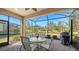 Spacious screened patio with dining area and grill at 12667 Sorrento Way, Bradenton, FL 34211