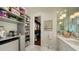 Convenient bathroom with built-in shelving, walk-in closet, and coffee bar at 1430 Harbor Dr, Sarasota, FL 34239