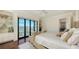 Bedroom with king-size bed, built-in shelving, and water views at 1430 Harbor Dr, Sarasota, FL 34239