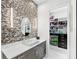 Bathroom with walk-in closet and modern vanity at 15407 Castle Park Ter, Lakewood Ranch, FL 34202
