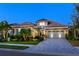 Stunning two-story home with a charming facade and landscaped yard at 15407 Castle Park Ter, Lakewood Ranch, FL 34202