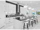 White kitchen with dark countertops and stainless steel appliances at 15407 Castle Park Ter, Lakewood Ranch, FL 34202